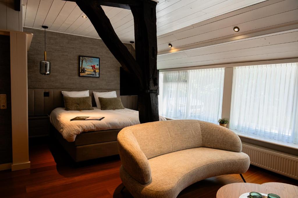 Postel nebo postele na pokoji v ubytování B&B Het Wellnest