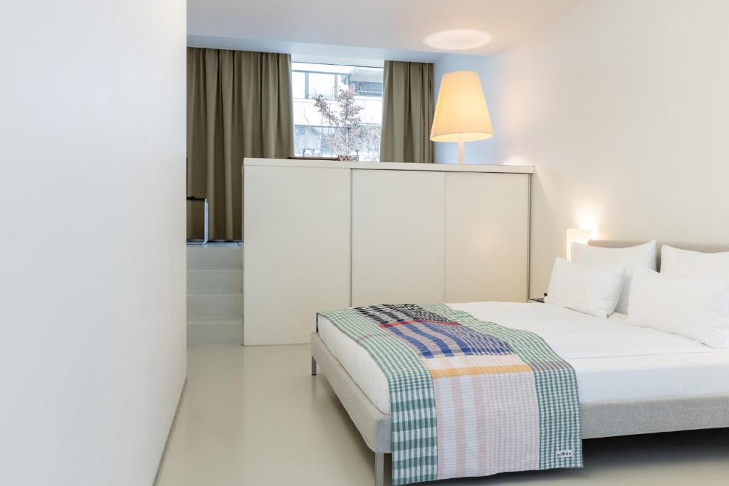 Postel nebo postele na pokoji v ubytování Greulich Design & Boutique Hotel