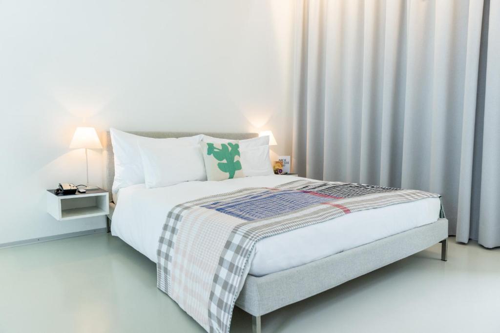 Postel nebo postele na pokoji v ubytování Greulich Design & Boutique Hotel