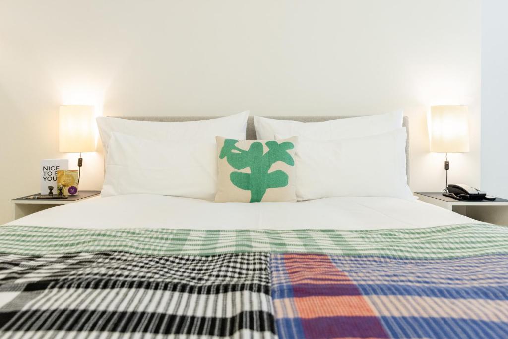Postel nebo postele na pokoji v ubytování Greulich Design & Boutique Hotel