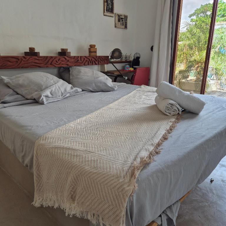 Postel nebo postele na pokoji v ubytování Marie Galante CHAMBRE CHEZ L HABITANT petit déjeuner sur demande