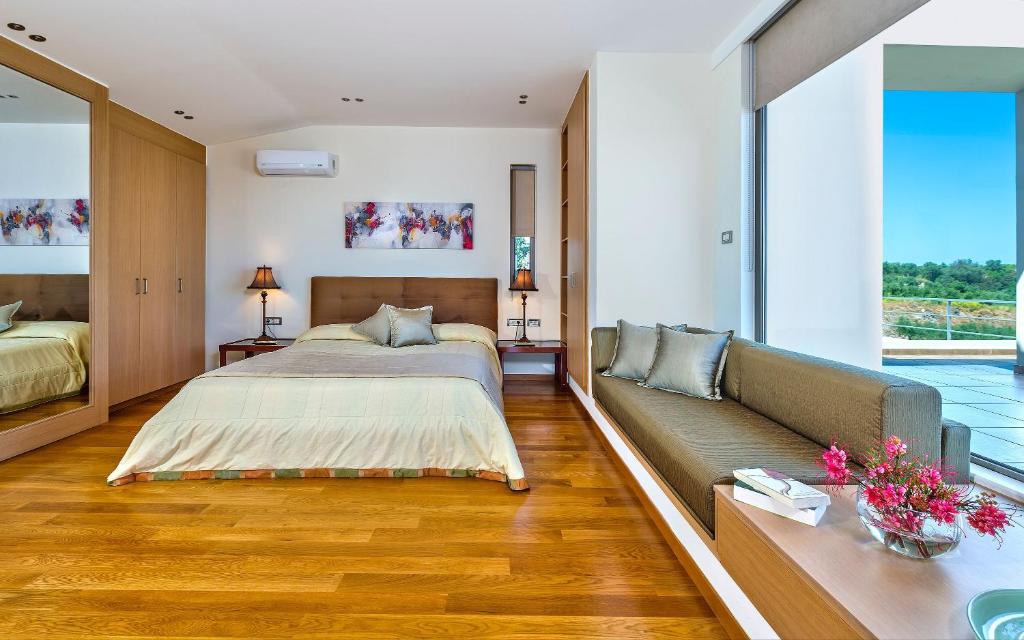 A bed or beds in a room at Villa Anastasia - Private Pool & Panoramic Views