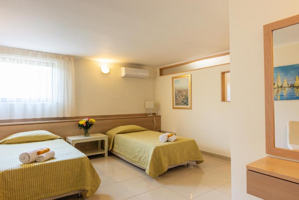 A bed or beds in a room at Villa Anastasia - Private Pool & Panoramic Views