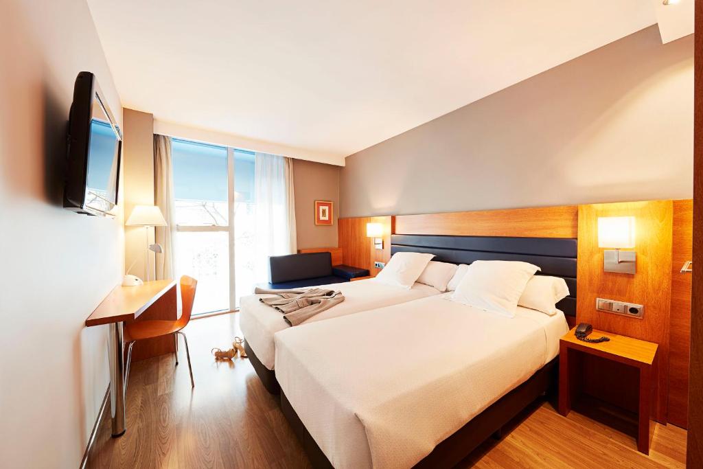 Posteľ alebo postele v izbe v ubytovaní Barcelona Century Hotel