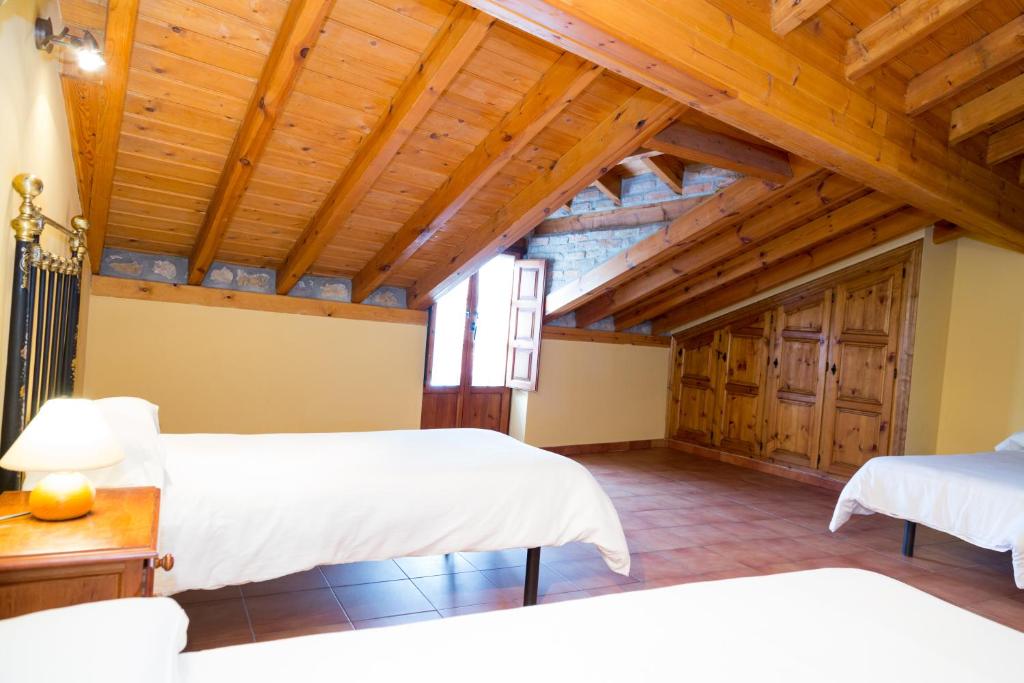Postel nebo postele na pokoji v ubytování Viviendas rurales Fuente Domingo