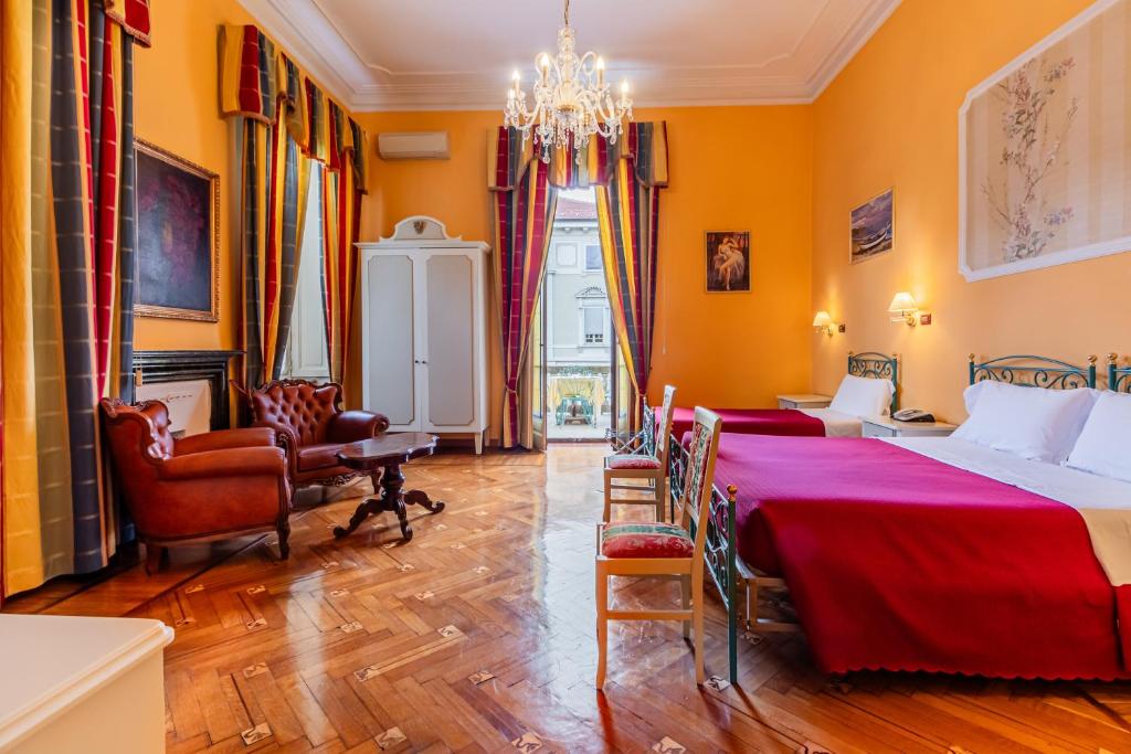 Postel nebo postele na pokoji v ubytování Hotel Principi D'Acaja