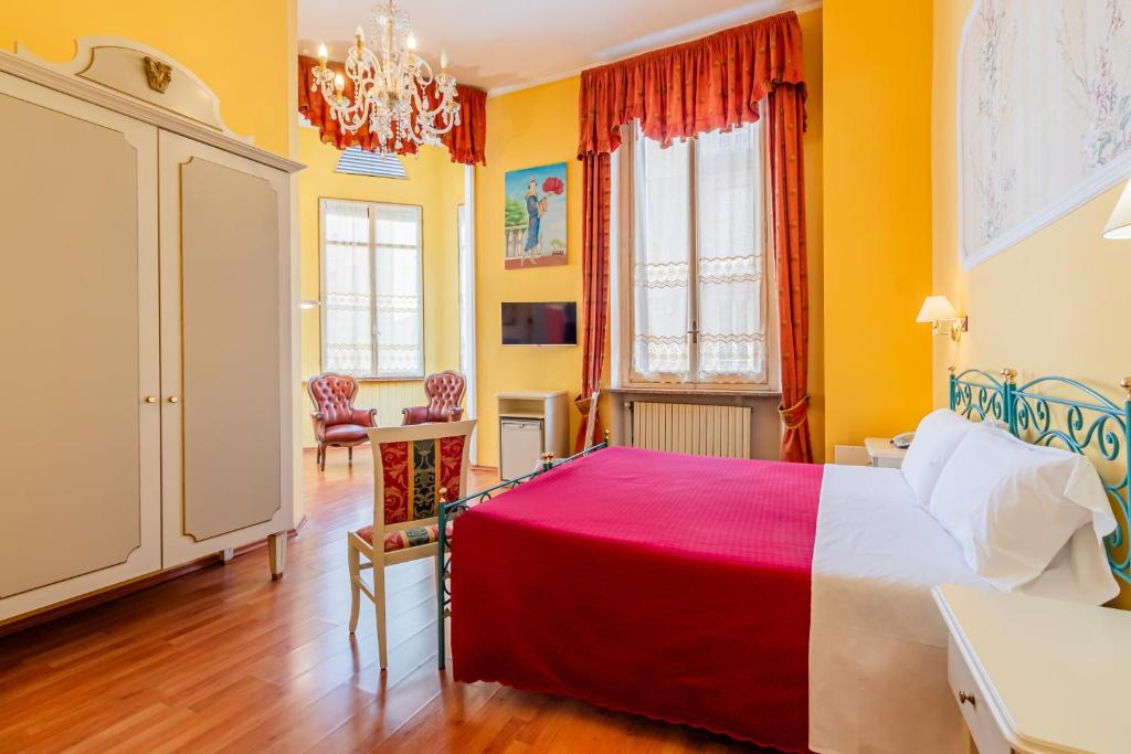 Postel nebo postele na pokoji v ubytování Hotel Principi D'Acaja