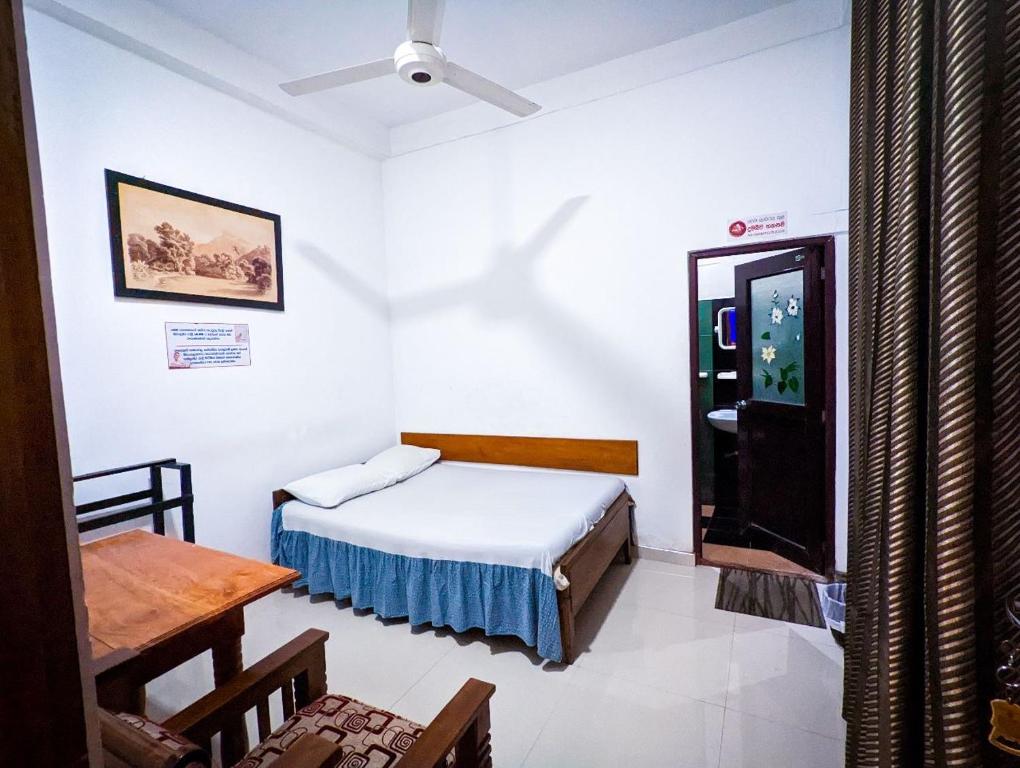 Postel nebo postele na pokoji v ubytování Hotel Change,Badulla