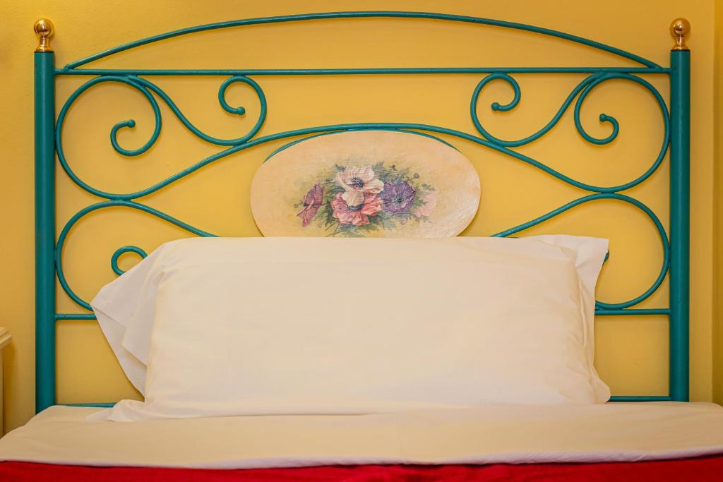 Postel nebo postele na pokoji v ubytování Hotel Principi D'Acaja