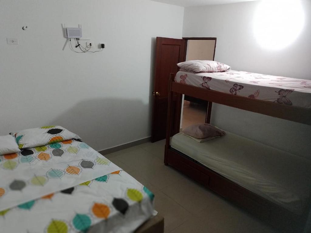 Postel nebo postele na pokoji v ubytování Los primos