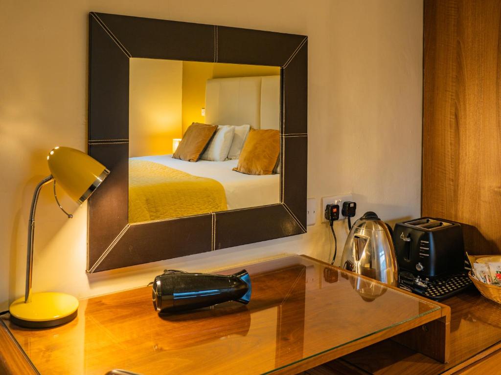Postel nebo postele na pokoji v ubytování Bagshaw Lodge