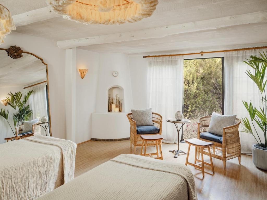 Postel nebo postele na pokoji v ubytování The Scott Resort & Spa
