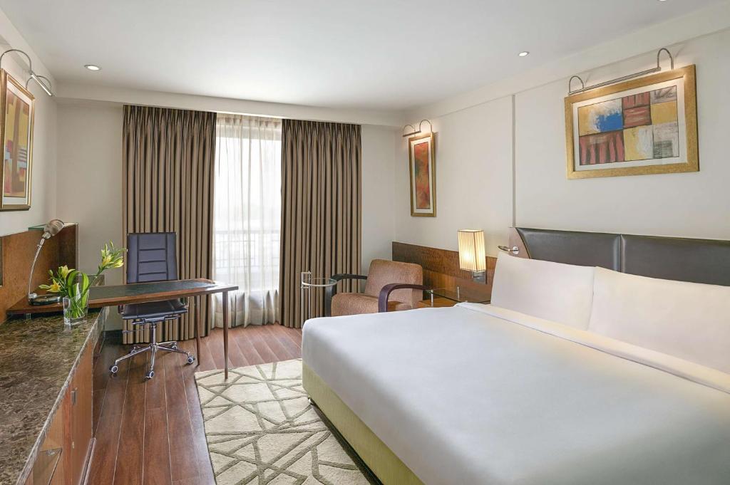Posezení v ubytování Radisson Blu Plaza Delhi Airport