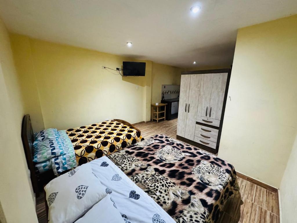 En eller flere senge i et værelse på Casa de huéspedes