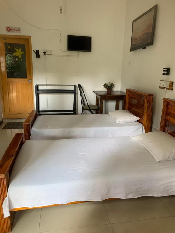 Postel nebo postele na pokoji v ubytování Hotel Change,Badulla