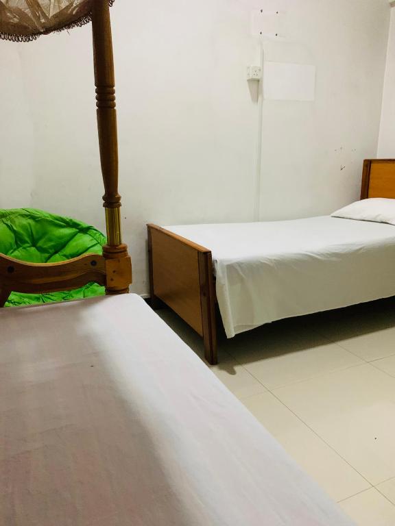 Postel nebo postele na pokoji v ubytování Hotel Change,Badulla