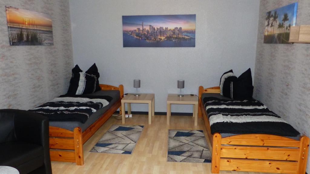a room with two beds in a room with a city at Haus am Bahndamm in Holzminden