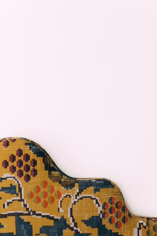 a close up of a couch with a rug at Pergola Boutique Hotel in Cascais