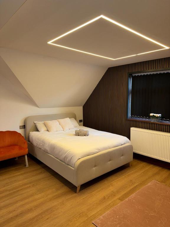 Postel nebo postele na pokoji v ubytování M16 Deluxe Apartment - 4