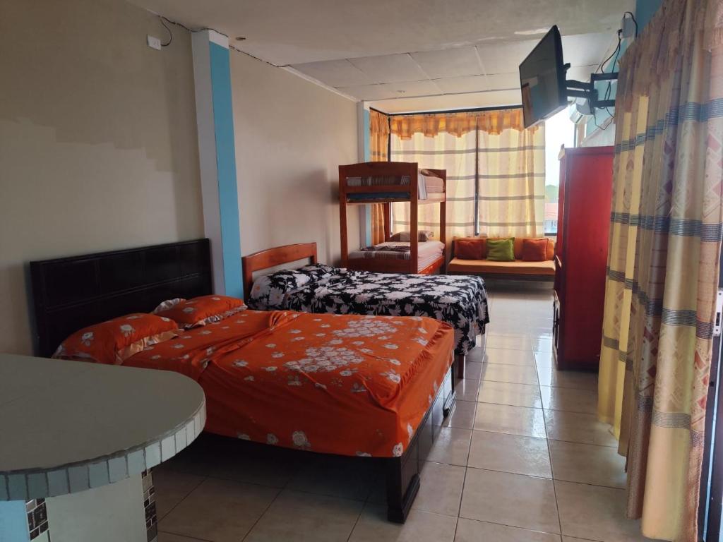 Postel nebo postele na pokoji v ubytování Hotel South Beach Atacames