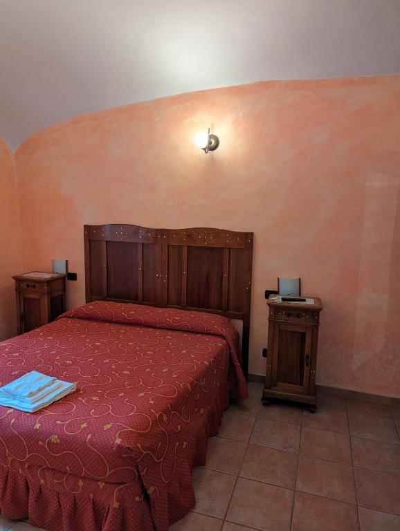Postel nebo postele na pokoji v ubytování Hotel il Rifugio del Lupo scanno