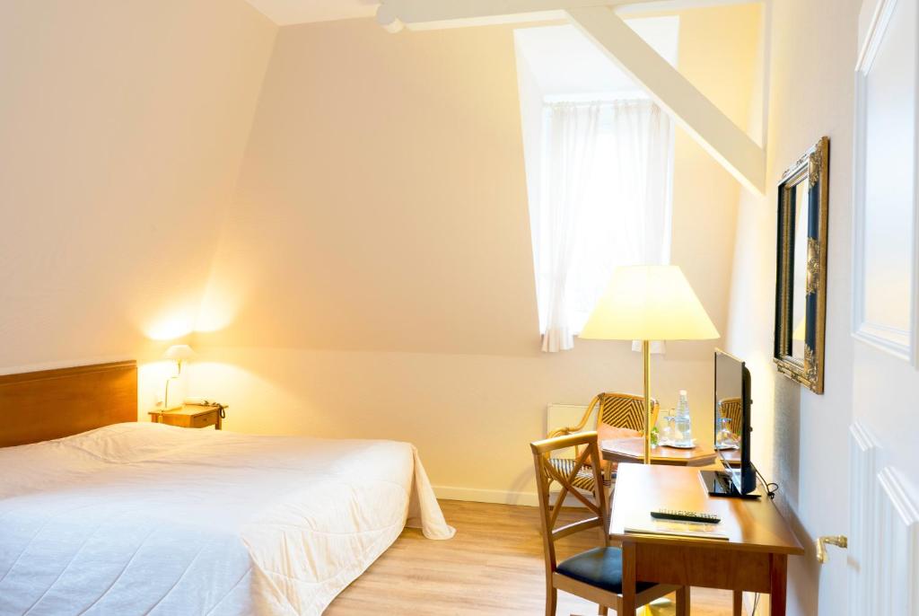 Postel nebo postele na pokoji v ubytování Hotel Villa Viktoria Luise