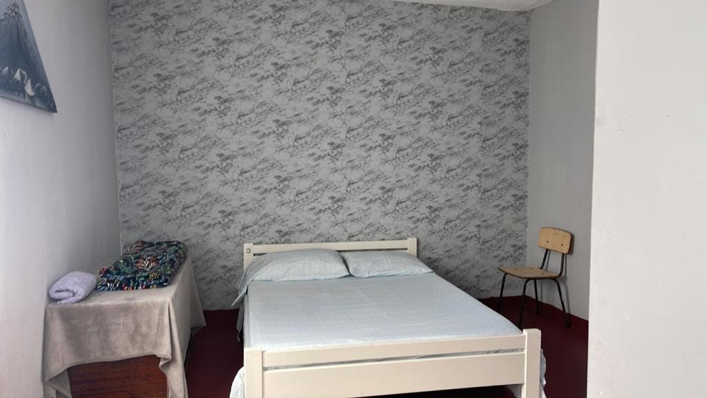 Postel nebo postele na pokoji v ubytování Pensão Rilda Montrond