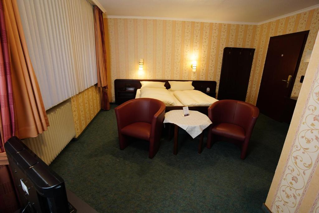 Postel nebo postele na pokoji v ubytování Hotel Central