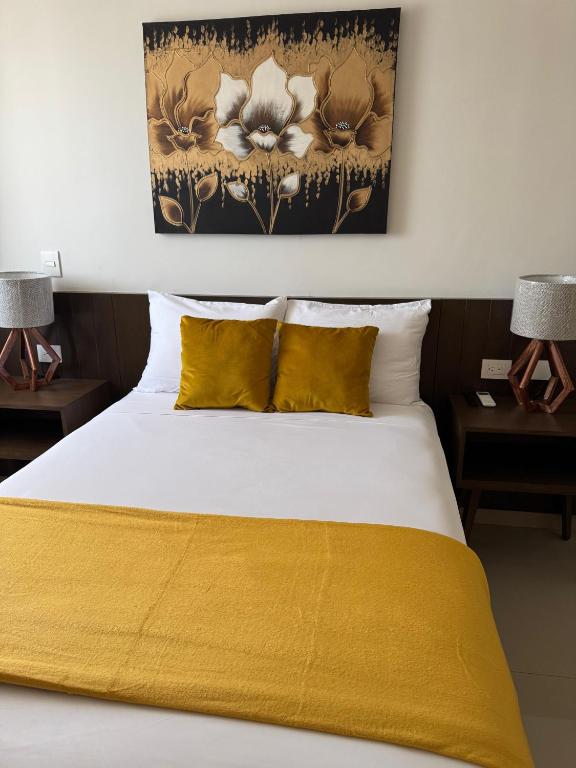 Uma cama ou camas num quarto em Hotel Faava