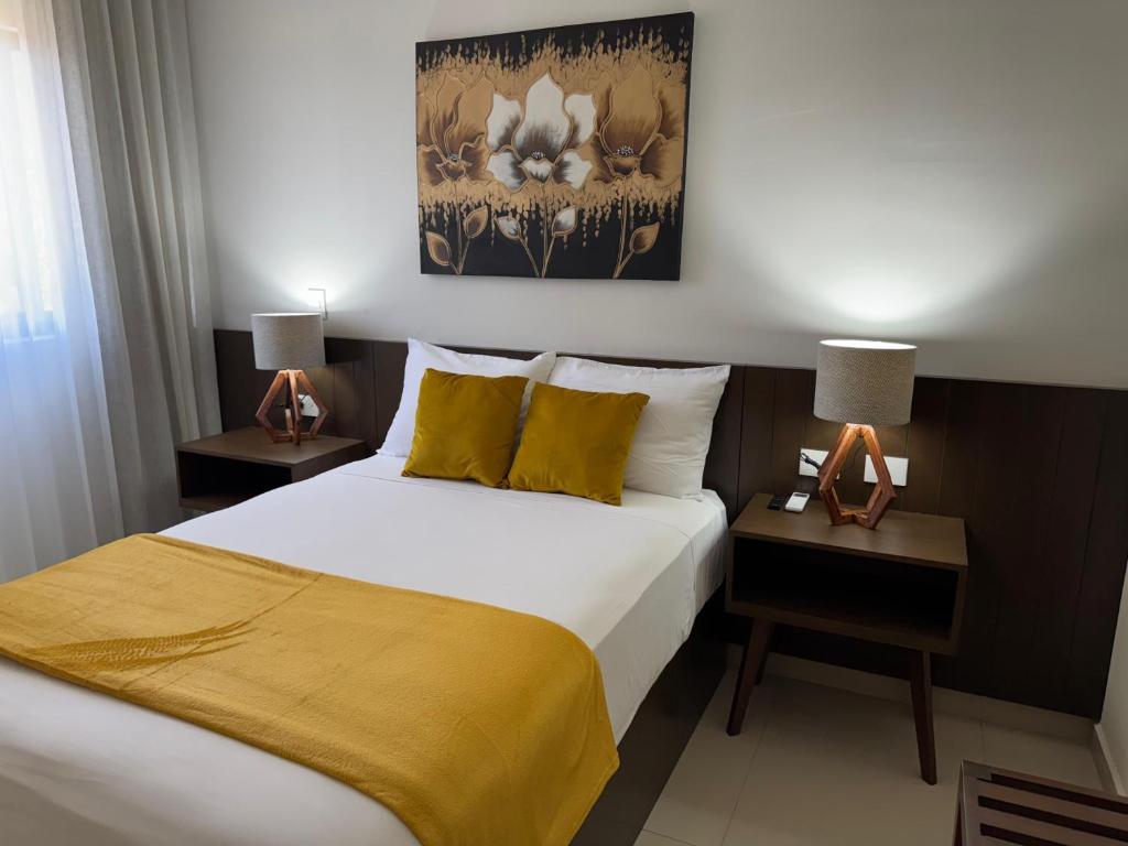 Uma cama ou camas num quarto em Hotel Faava