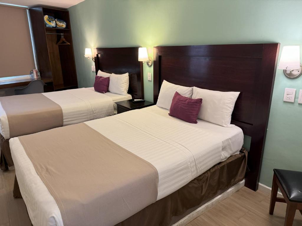 Postel nebo postele na pokoji v ubytování Hotel Arribo
