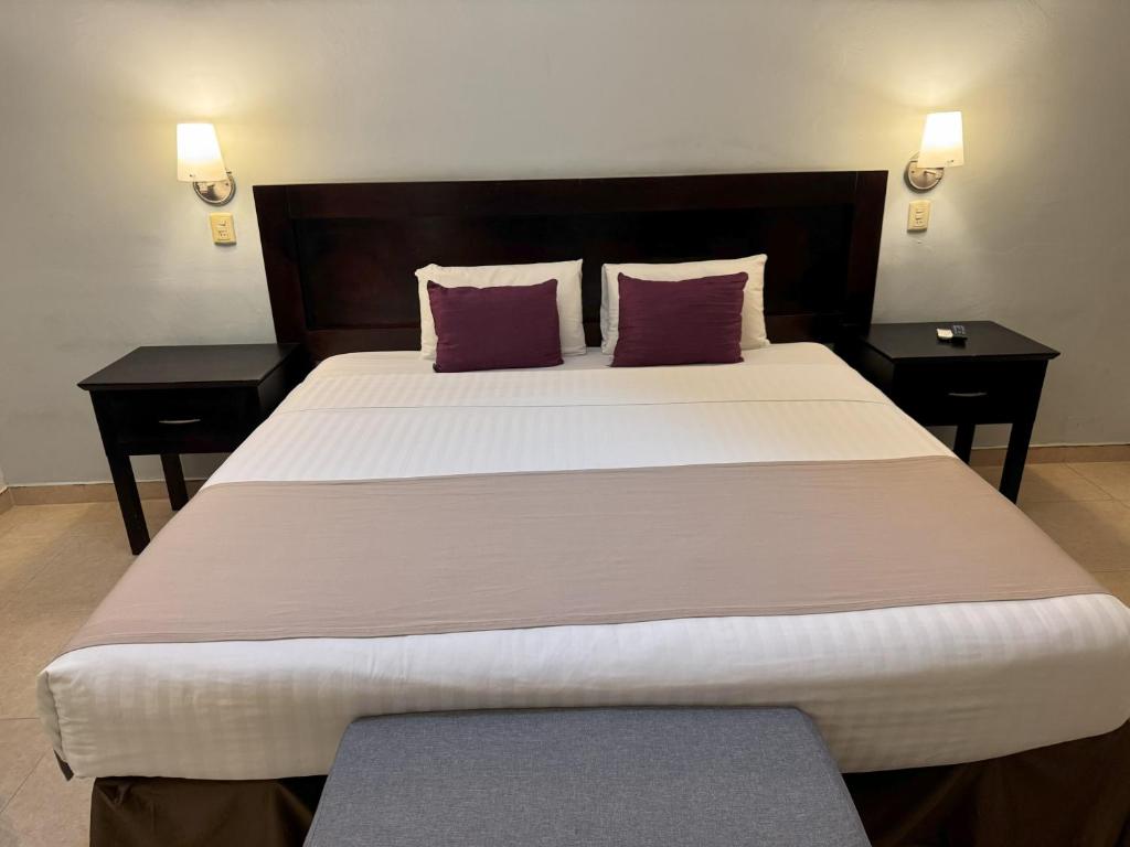 Postel nebo postele na pokoji v ubytování Hotel Arribo