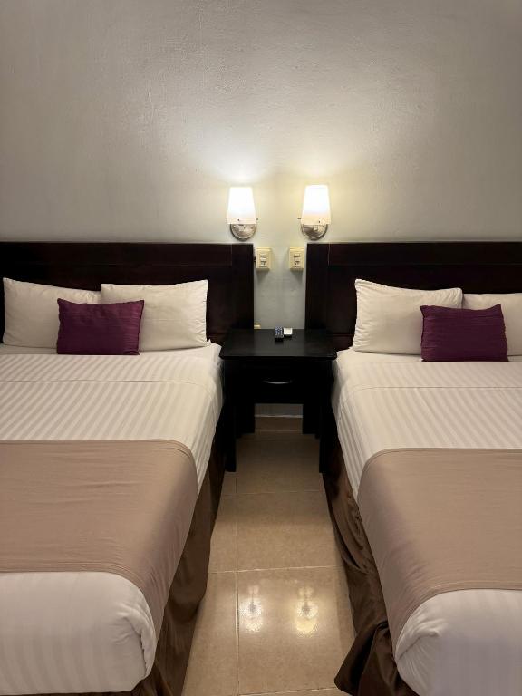 Postel nebo postele na pokoji v ubytování Hotel Arribo