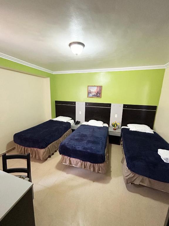 Postel nebo postele na pokoji v ubytování HOTEL 2 Mares PANAMA