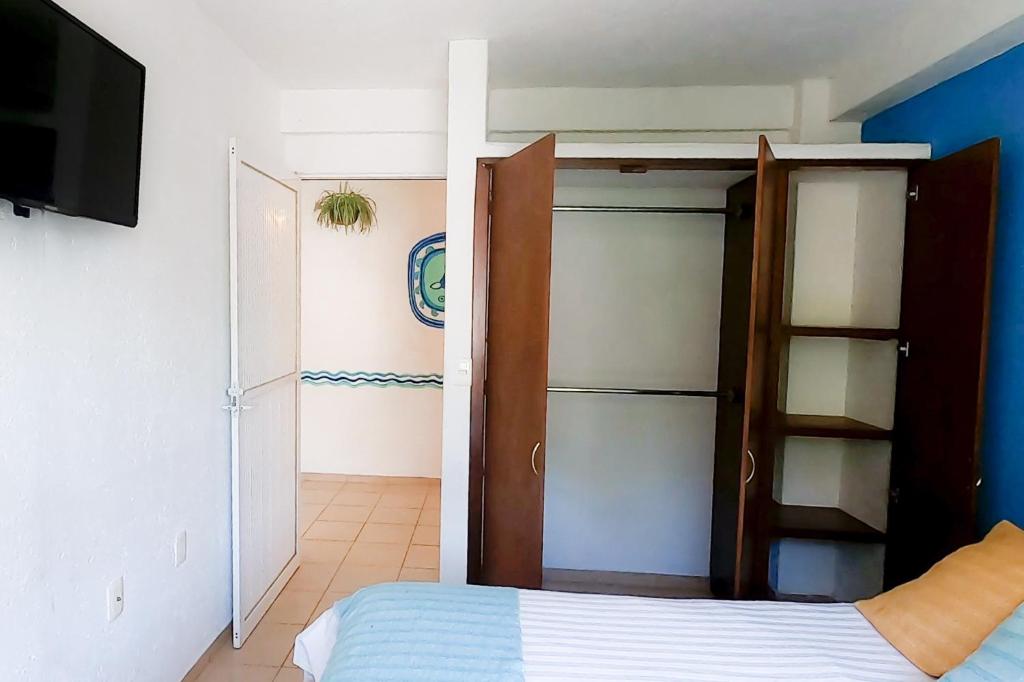 Postel nebo postele na pokoji v ubytování La Pirámide del Tepozteco