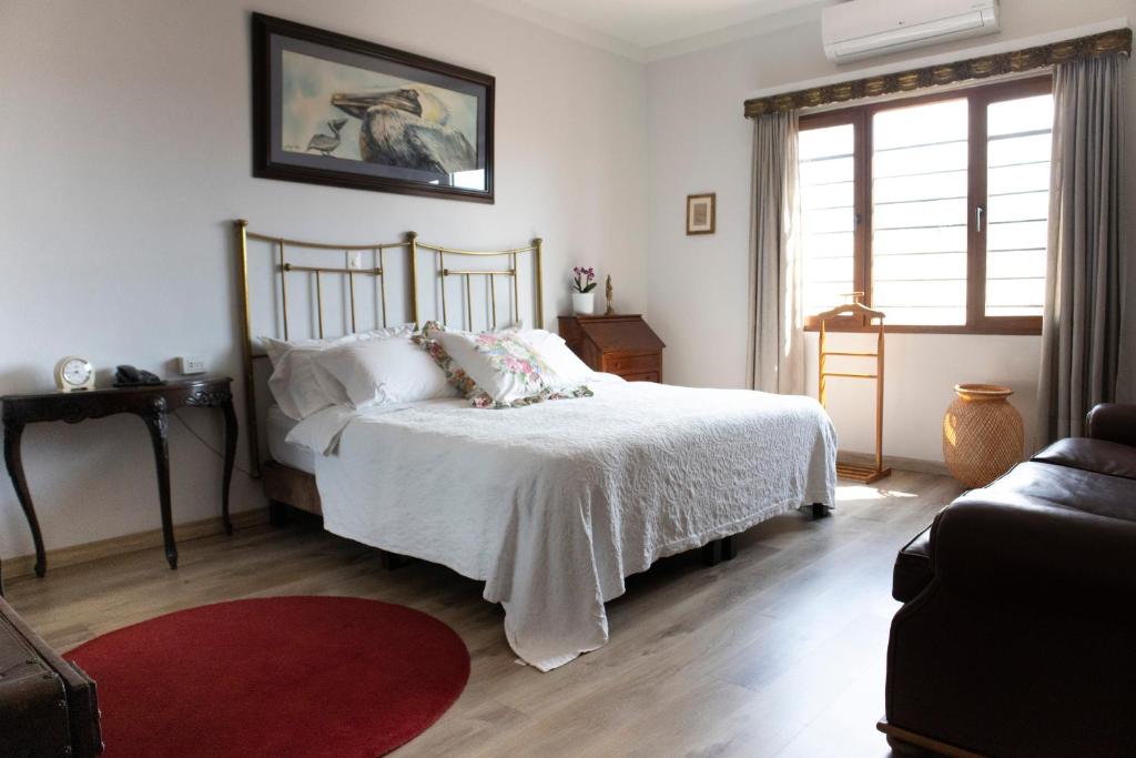 Postel nebo postele na pokoji v ubytování Hotel Don Alfonso
