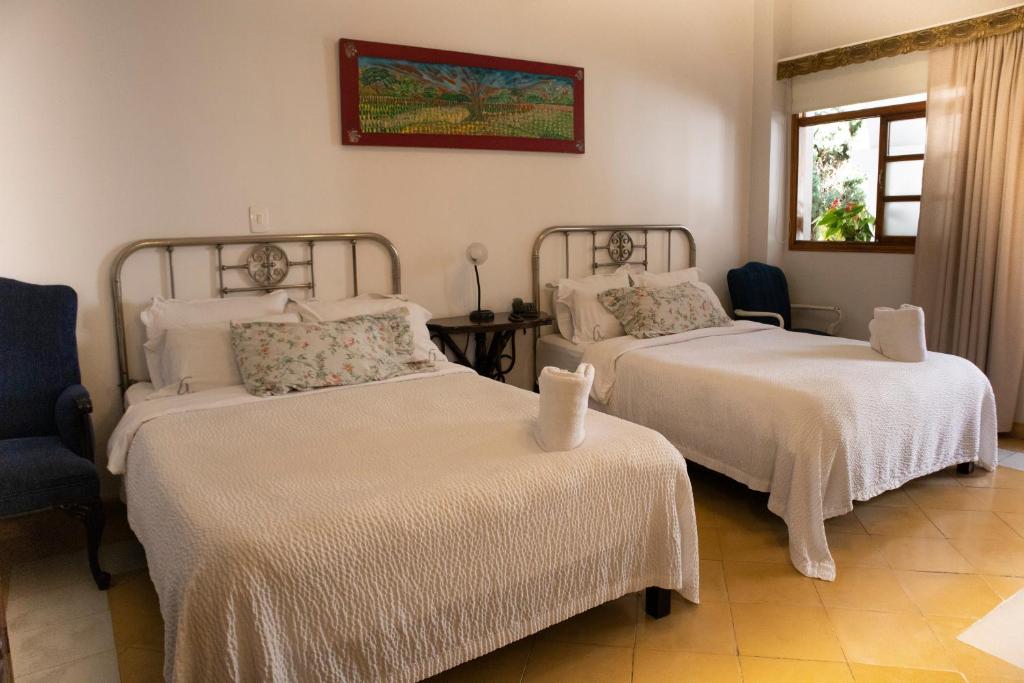 Postel nebo postele na pokoji v ubytování Hotel Don Alfonso