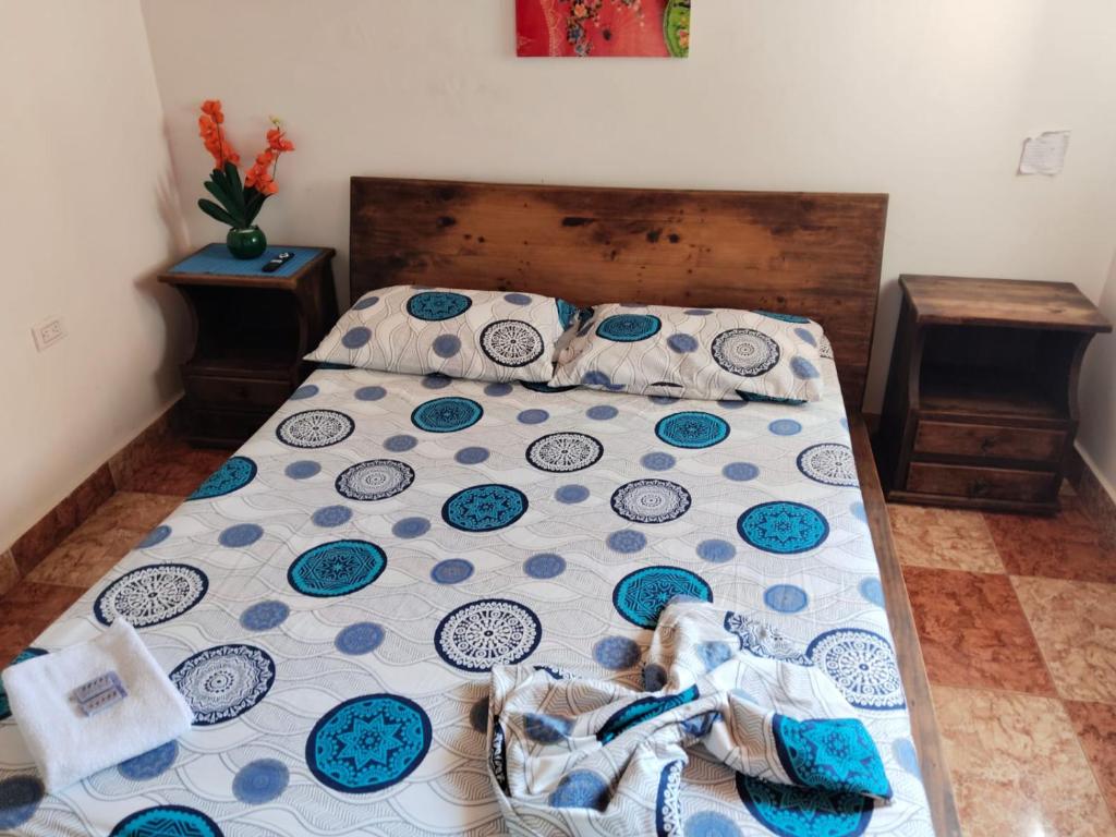 Postel nebo postele na pokoji v ubytování Hostal Casa Yare