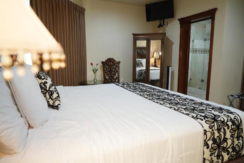 Postel nebo postele na pokoji v ubytování Hotel Real de La Peña