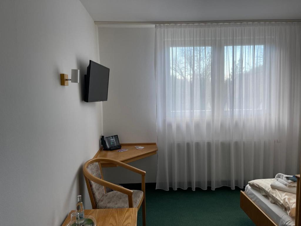 TV a/nebo společenská místnost v ubytování Waldhotel Linzmühle