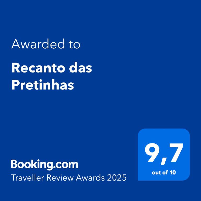 a blue text box with the text awarded to recanta da pertimias at Recanto das Pretinhas in Ibiúna