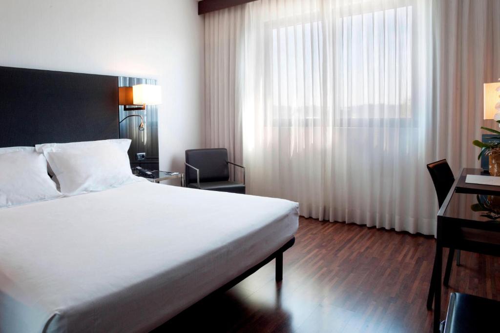 Postel nebo postele na pokoji v ubytování AC Hotel Padova by Marriott