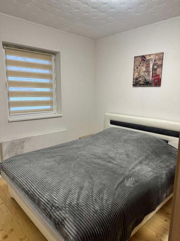 Postel nebo postele na pokoji v ubytování Lily Apartmani Brzece