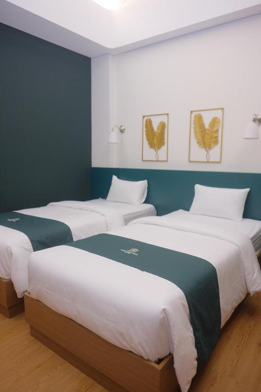 Postel nebo postele na pokoji v ubytování Agung Guest House by RF