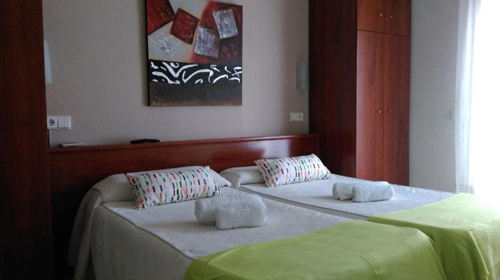 Postel nebo postele na pokoji v ubytování Hostal Termes