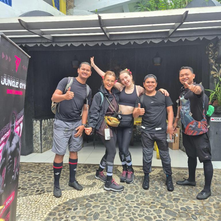 a group of people posing for a picture at Jungle Inn Bukit lawang in Bukit Lawang