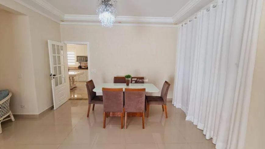 a dining room with a table and chairs at Casa das flores in Sao Paulo