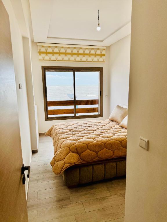 Postel nebo postele na pokoji v ubytování Appartements face a la mer