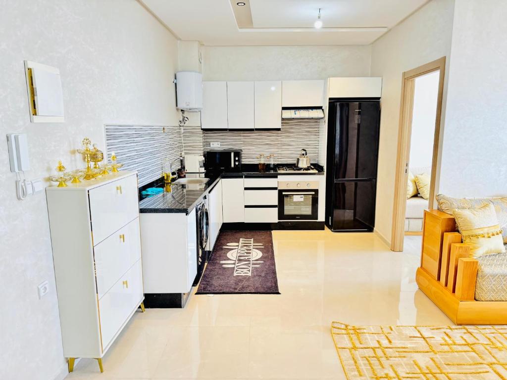 Kuchyň nebo kuchyňský kout v ubytování Appartements face a la mer