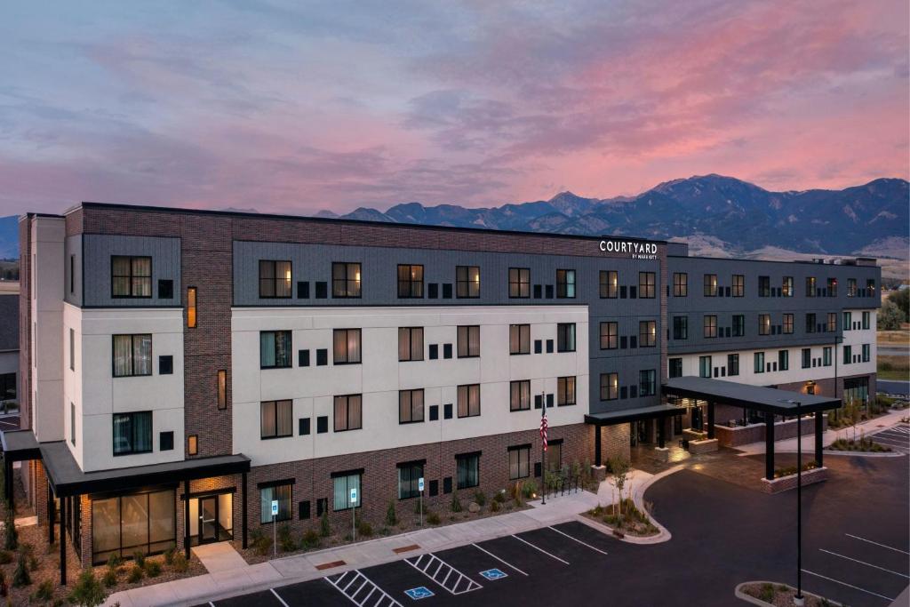 a rendering of a hotel with a parking lot at Courtyard by Marriott Bozeman in Bozeman